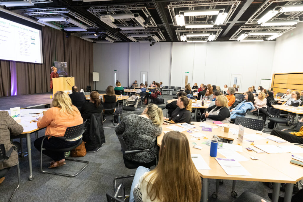 Picture of attendees at the Wales Women in tech event, viewing a presentation